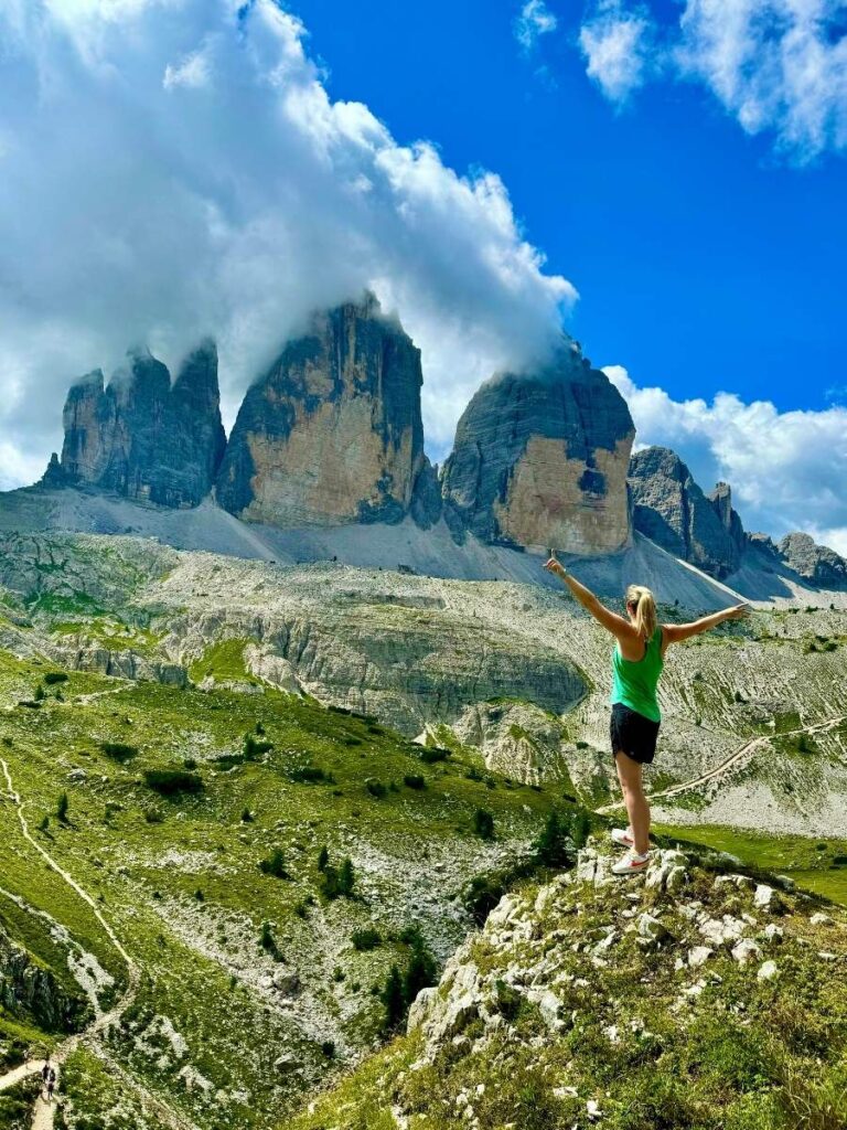 Amanda standing in front of Tre Cime - Dolomites, Italy